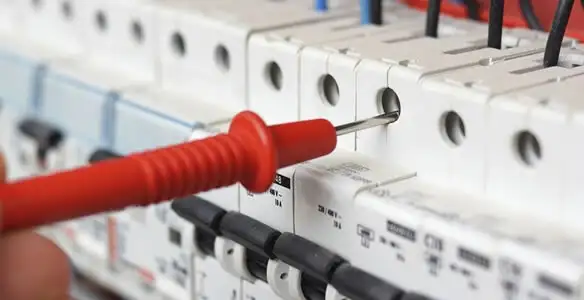 Electrical contractor testing circuit breakers during electrical repair in Federal Way, WA