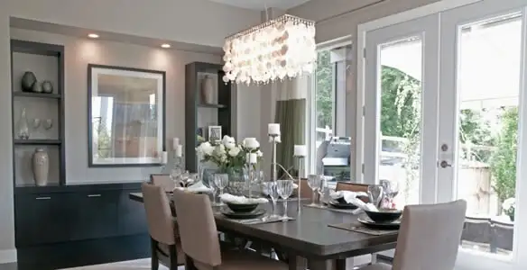 Elegant dining room chandelier installation above table in Tacoma, WA