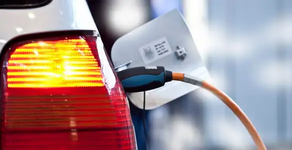 Electric car plugged into EV charger after professional installation in Tacoma, WA