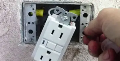 gfci circuits service showing installation of a ground fault circuit interrupter outlet by licensed electricians in Tacoma, WA