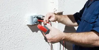 Electrician performing home electrical outlet and wiring inspection in Tacoma, WA