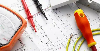 licensed electrician planning and testing electrical systems using professional tools in Tacoma, WA