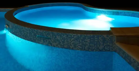 pool light installation and repair services highlighting illuminated pool interior lighting in Tacoma, WA
