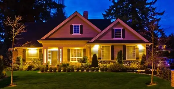 security light installation services illuminating a residential exterior at night in Tacoma, WA