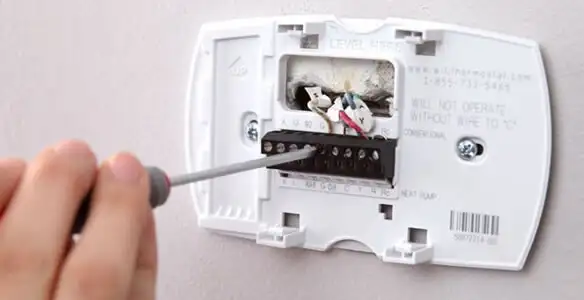 Thermostat installation service with proper wiring and secure wall mounting in Tacoma, WA