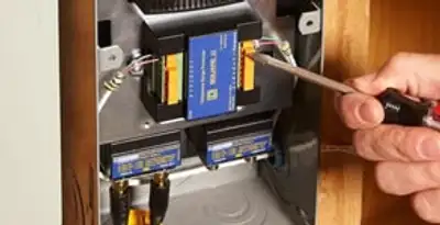 Whole home surge protection device being installed by a licensed electrician to protect electrical systems in Tacoma, WA
